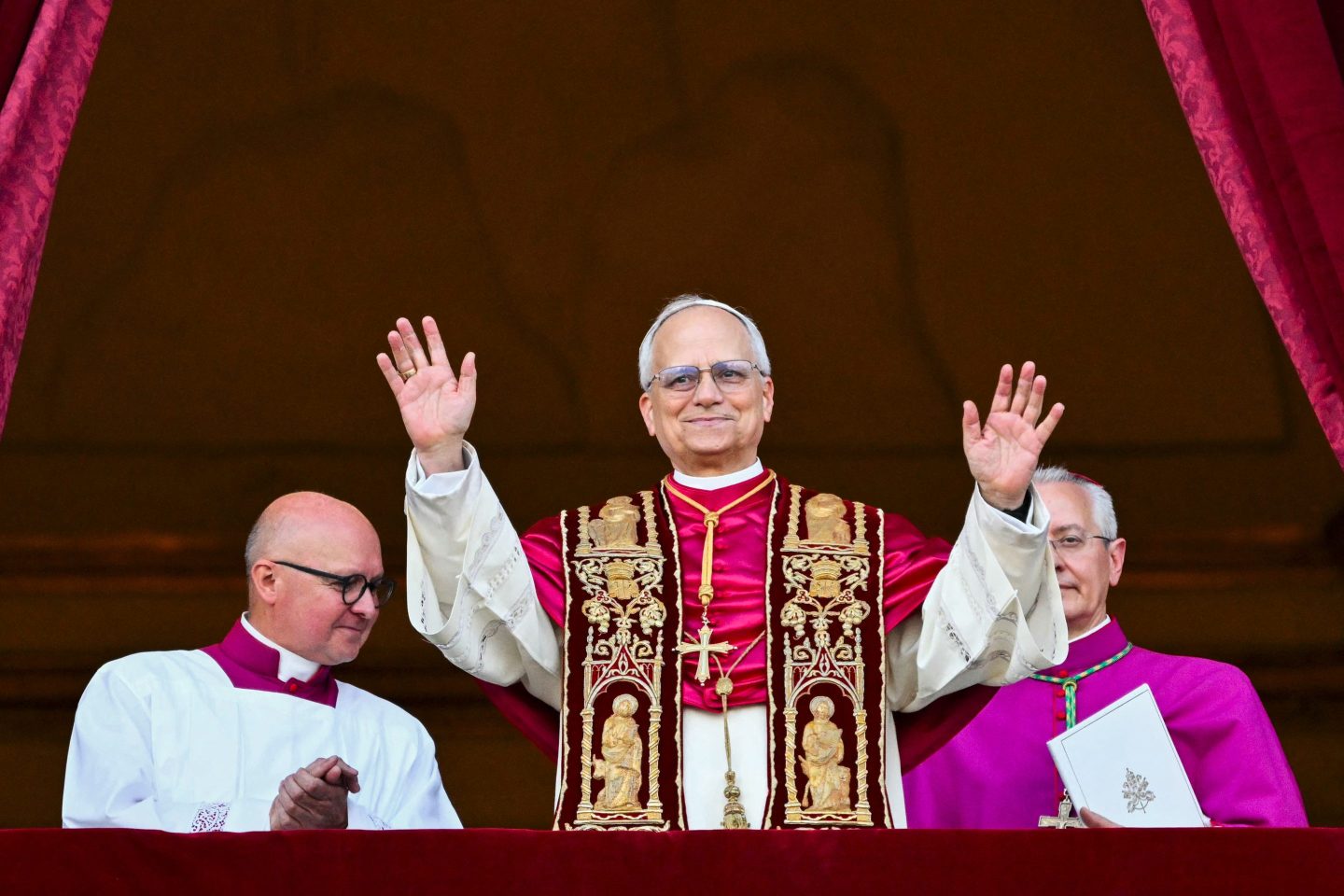 Newly elected Pope Robert Francis Prevost arrives on the main central loggia balcony of the St Peter&#039;s Basilica for the first time, after the cardinals ended the conclave, in The Vatican, on May 8, 2025. Robert Francis Prevost was on Thursday elected the first pope from the United States, the Vatican announced. A moderate who was close to Pope Francis and spent years as a missionary in Peru, he becomes the Catholic Church&#039;s 267th pontiff, taking the papal name Leo XIV. (Photo by Alberto PIZZOLI / AFP) (Photo by ALBERTO PIZZOLI/AFP via Getty Images)